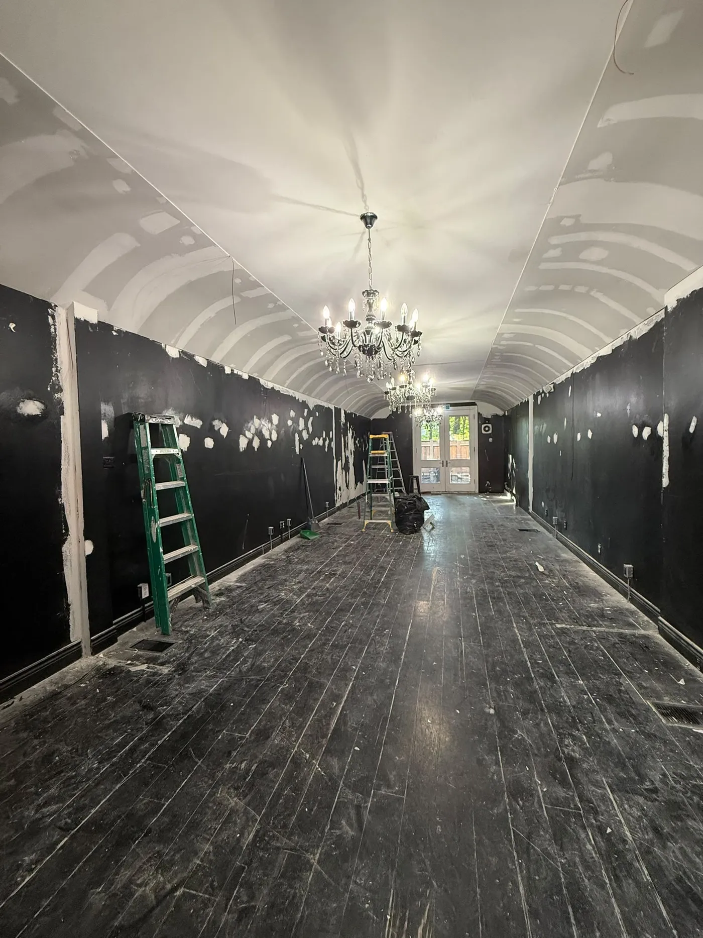 The salon emptied, with the walls still black.